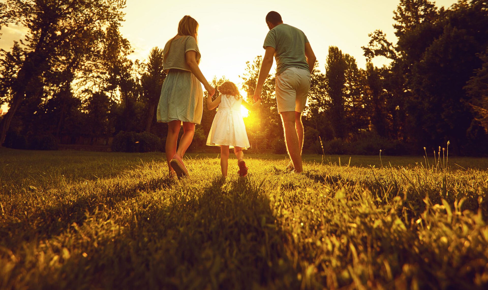 family walking together at sunset representing hope, healing, and generational recovery