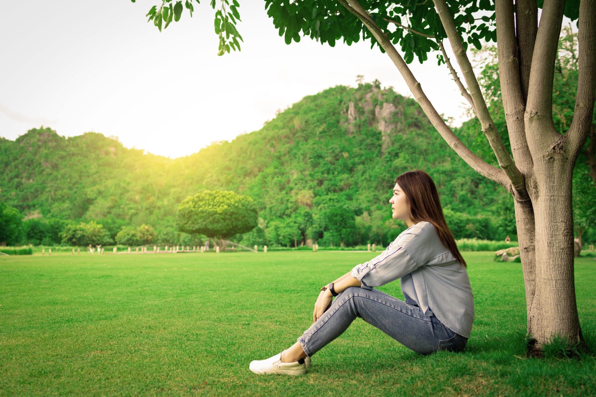 woman experiencing emotional healing and reflection in nature during recovery journey
